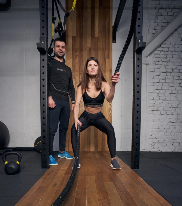 Personal trainer trains the girl