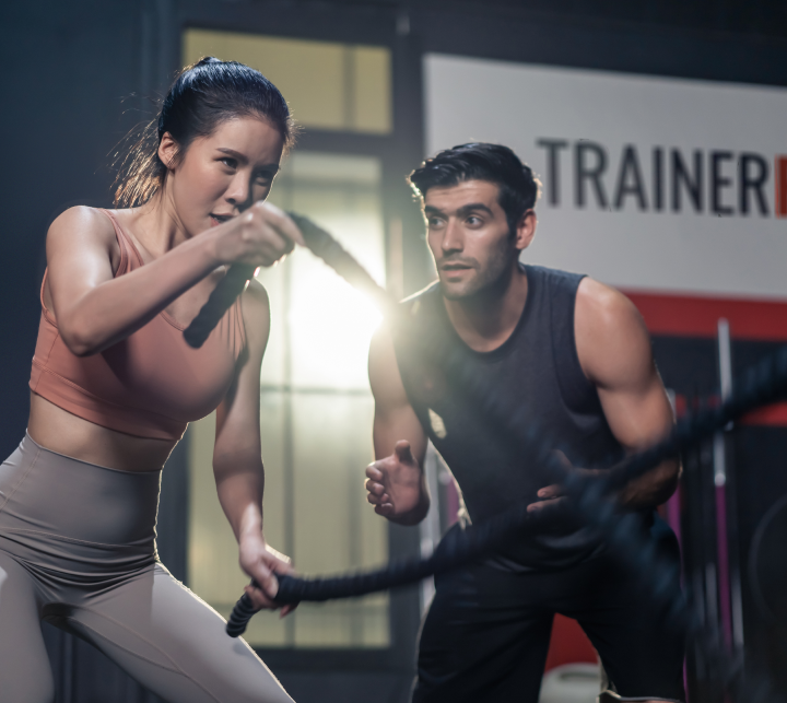 Professional personal trainer in Toronto guiding a client through a workout