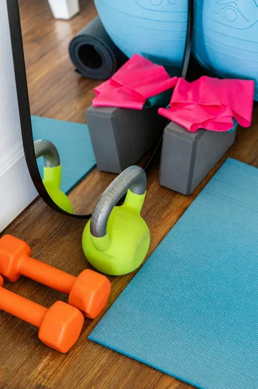 Personal trainer coaching a squat in North York